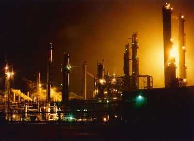 Image of refinery smoke stacks.