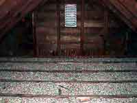 Zonolite vermiculite insulation in an attic.